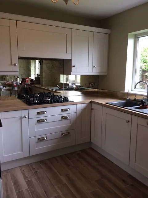 Antique mirror in a traditional kitchen splashback