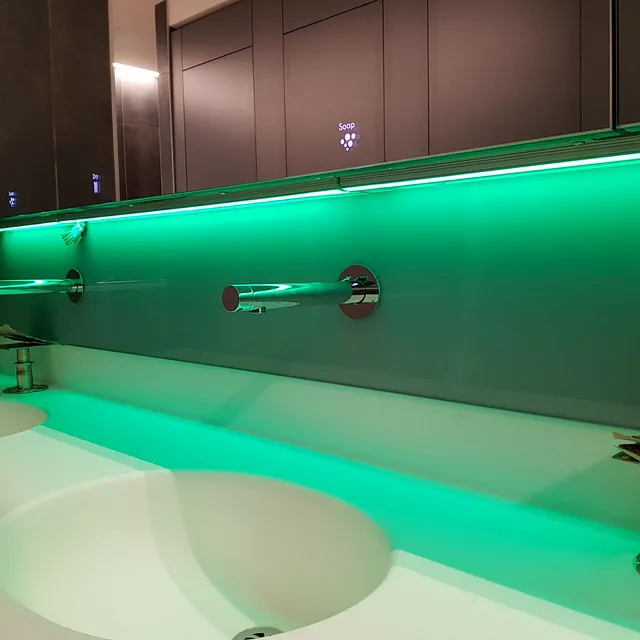 modern splashback with green lightening installed over a contemporary sink